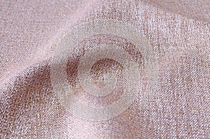 Closeup gold,yellow,pink gold colors fabric texture backdrop. pink gold,yellow, linen fabric glitter pattern sample for design or