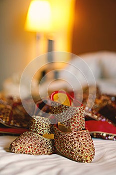 Closeup of golden Indian style bridal heals for wedding