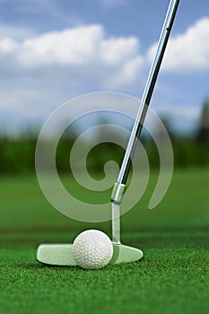 Closeup golf club and ball