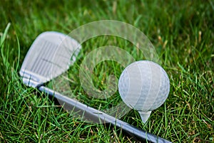 Closeup on golf club and golf ball