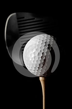 Closeup of Golf Club and Golf Ball on Tee