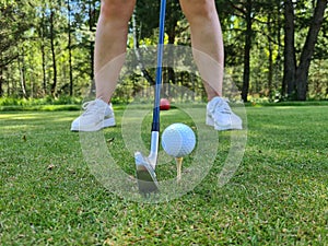 Closeup of golfer ready to tee off