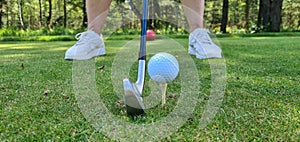 Closeup of golfer ready to tee off