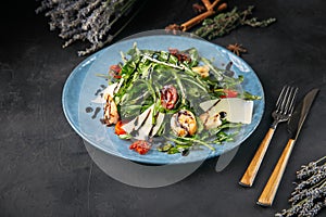 Closeup on gourmet salad with arugula and shrimps