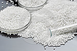 Closeup of a granule of white plastic polymer