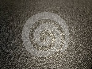 Closeup of gray leathery cushion