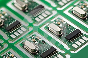 Closeup of green electronic circuit board with processor