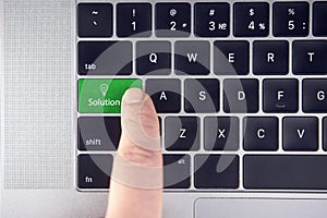 Closeup of green solution button on the keyboard