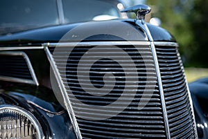 Closeup of grille of a restored antique automobile