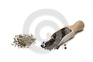 Closeup ground peppercorns pepper shovel white background