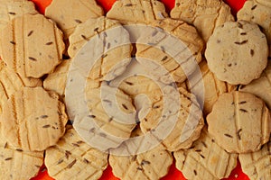 Closeup of a group of assorted carom seeds cookies.