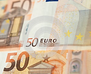 Closeup of a group of fifty euros banknote background