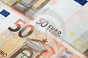 Closeup of a group of fifty euros banknote background