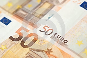 Closeup of a group of fifty euros banknote background