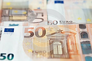 Closeup of a group of fifty euros banknote background