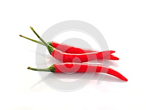 Closeup group of hot spicy red Thai chili peppers isolated on a white background