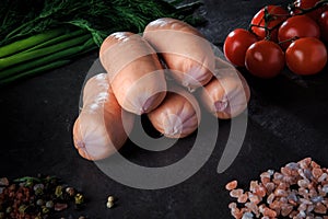 closeup group of short sausages with onion, dill, tomatoes