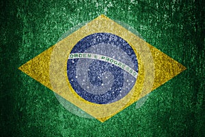 Closeup of grunge Brazilian flag. Dirty Brazil flag on a metal surface