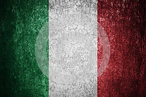 Closeup of grunge Italian flag. Dirty Italy flag on a metal surface