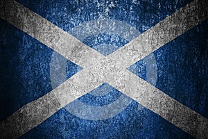 Closeup of grunge Scottish flag. Dirty Scotland flag on a metal surface