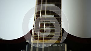 Closeup guitar strings strum