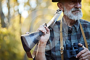 Closeup of gun hoding by hunter