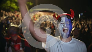 Closeup guy scream furiously, jump friend backdrop crowd to win football soccer