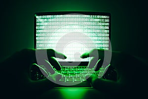 Closeup of hacker is using the laptop computer to coding virus or malware for hacking internet server, Cyber attack, System