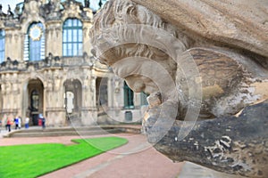 Closeup half naked faunus statue playing panpipe at Zwinger palace in Dresden