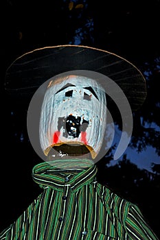 Closeup of the Halloween scarecrow dressed in green shirt