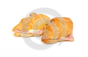 Closeup of Ham Cheese croissant on white