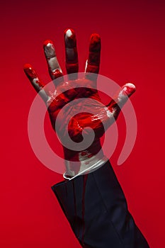businessman hand with red paint, generative AI photo