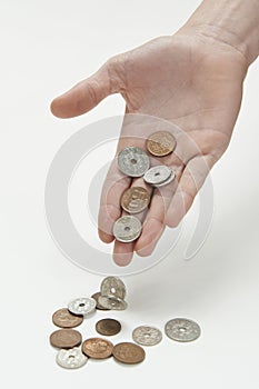 Hand dropping danish currency photo