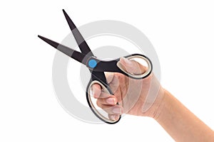 Closeup hand holding black steel scissors.