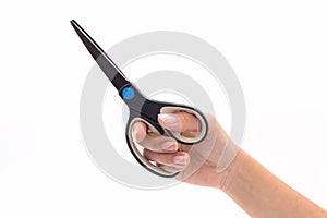 Closeup hand holding black steel scissors.