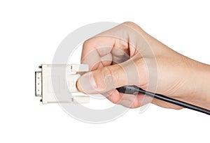 Closeup hand holding computer dvi cable plug and power socket