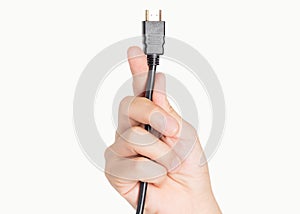 Closeup hand holding computer HDMI cable plug