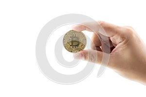 Closeup hand holding gold bitcoin isolated on white background,