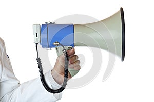 Closeup of a hand holding a megaphone.