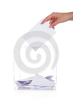 Closeup Of Hand Inserting Ballot In Box