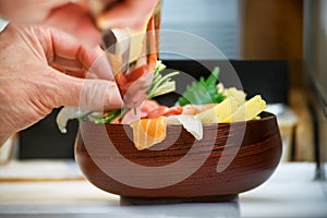 Closeup of hand of Japanese Sushi Chef