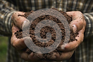 Closeup hand of person holding abundance soil for agriculture or