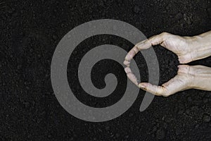 Closeup hand of person holding abundance soil for agriculture or planting peach