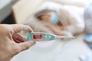 Closeup hand show Coronavirus flu detector device display show results and identify Covid-19 patients