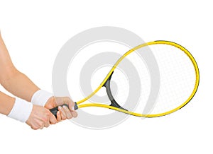 Closeup on hand of tennis player holding racket photo