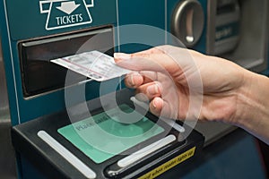 Closeup hand with train ticket from self service machine