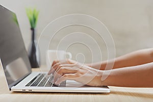 Closeup hand typing on keyboard computer