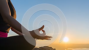Closeup the hand of woman with yoga posture on the mountain at s