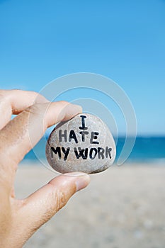 Man on the beach and text I hate my work