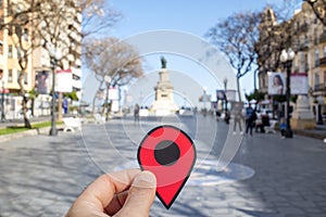 Red marker in Rambla Nova street, Tarragona, Spain photo